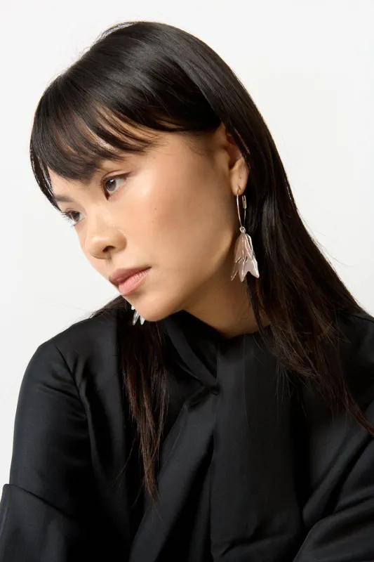 Jil Sander Hammered-Effect Finished Drop-Designed Earrings sold by Bessette