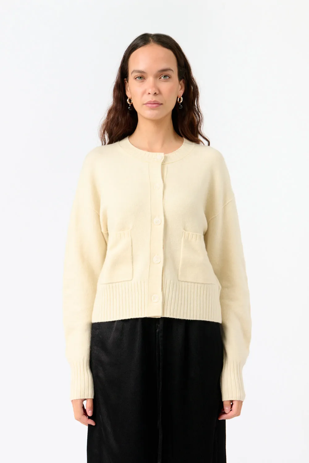 The White Classic Cardigan sold by Bessette