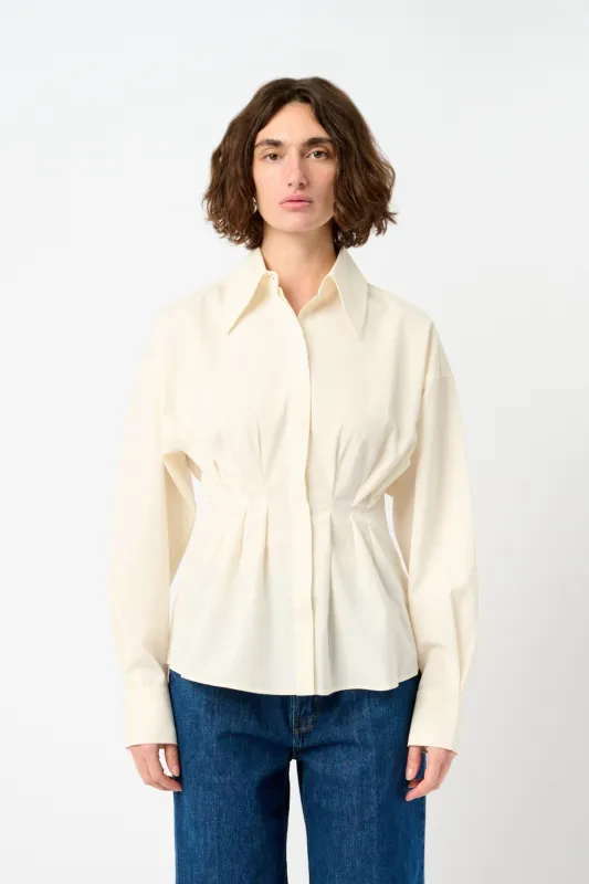 Pleated silk shirt sold by Bessette