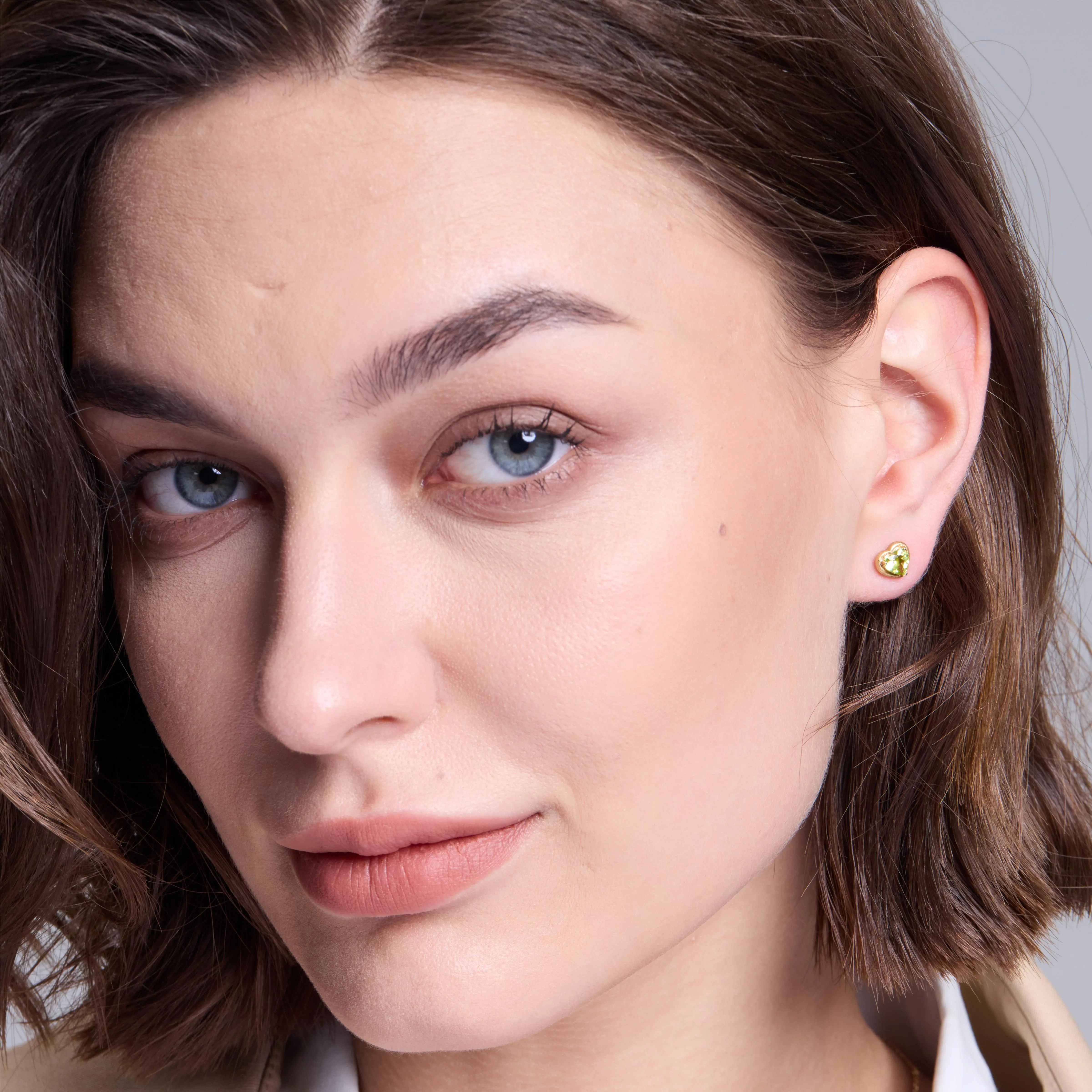 Charismatic Heart Gold Peridot Stud Earrings sold by Jescojes product image thumbnail 3