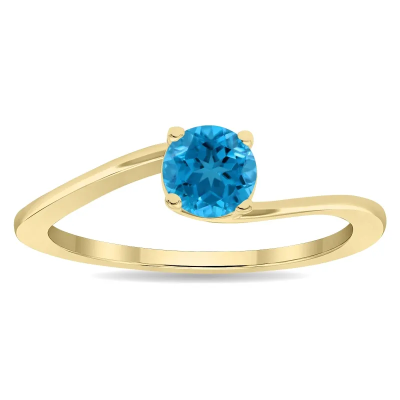 Women's Round Shaped Solitaire Blue Topaz Wave Ring in 10K Yellow Gold sold by Zulily