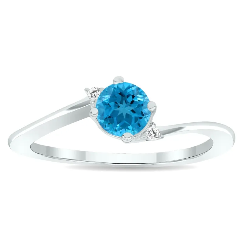 Women's Blue Topaz and Diamond Wave Ring in 10K White Gold sold by Zulily
