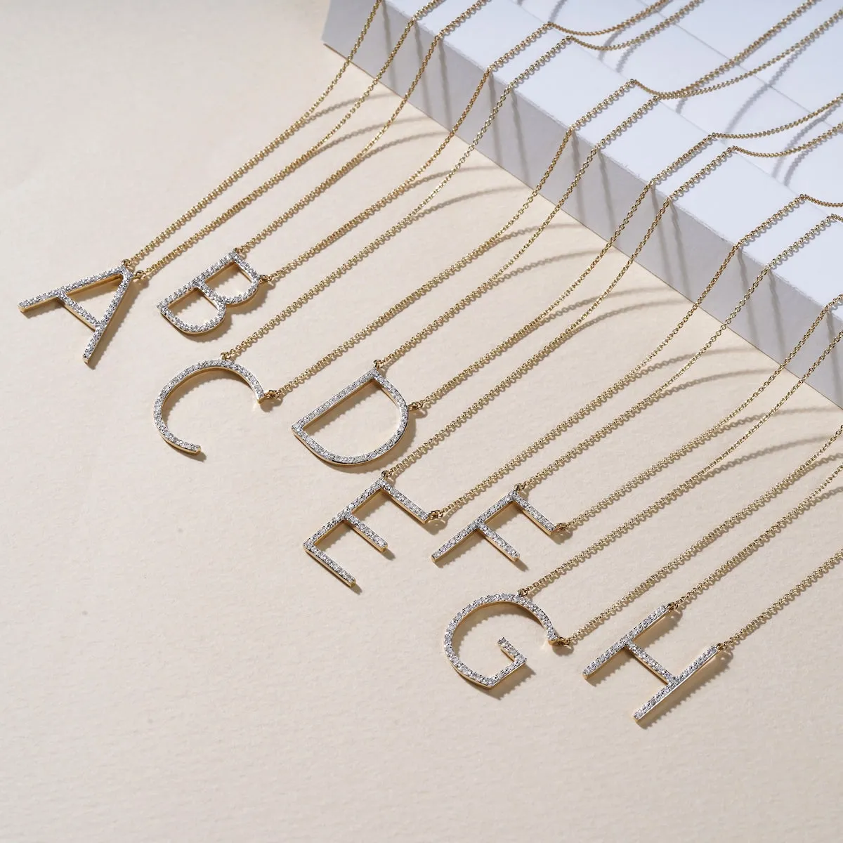 1/20ct TDW Diamond Classic Alphabet Pendant Necklace in Silver with Rhodium by De Couer sold by Zulily