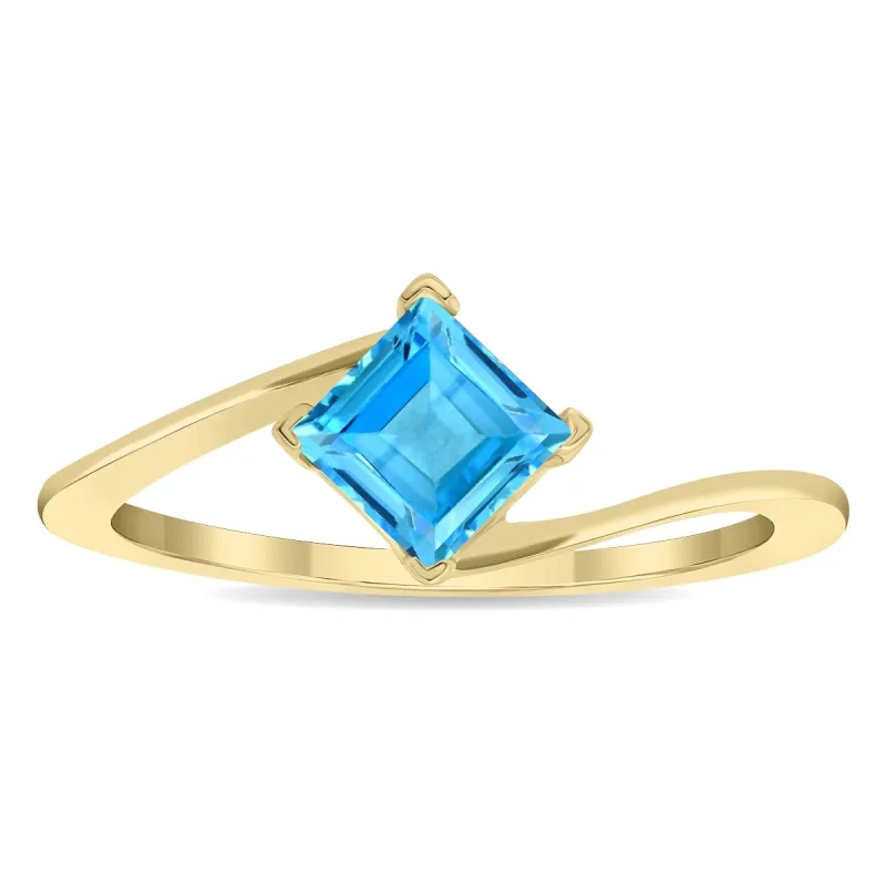 Women's Solitaire Square Shaped Blue Topaz Wave Ring in 10K Yellow Gold sold by Zulily