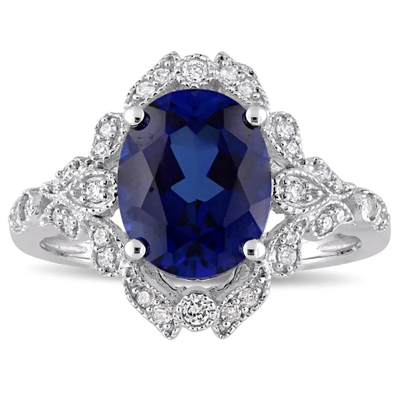 Miadora 10k White Gold Created Blue Sapphire and 1/5ct TDW Diamond Vintage Halo Cocktail Ring sold by Zulily