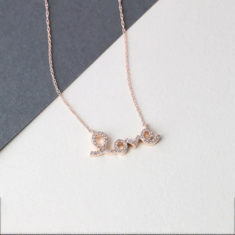 De Couer 10k Gold 1/6ct TDW Diamond "love" Necklace sold by Zulily