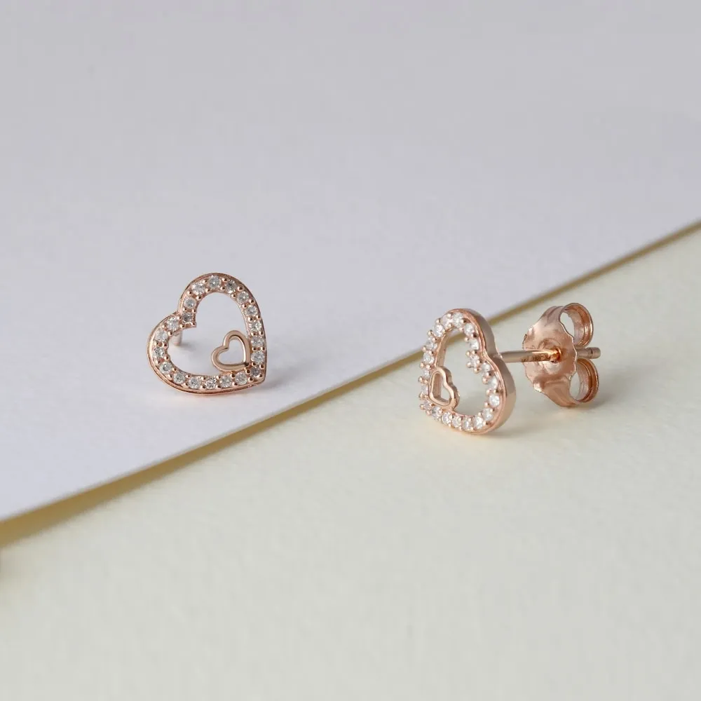 De Couer 10k Rose Gold 1/8ct TDW Diamond Heart Stud Earrings sold by Zulily