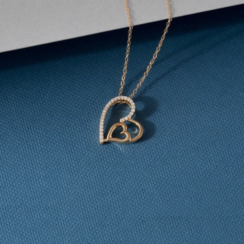 De Couer 10k Yellow Gold 1/10ct TDW Diamond Heart Necklace sold by Zulily
