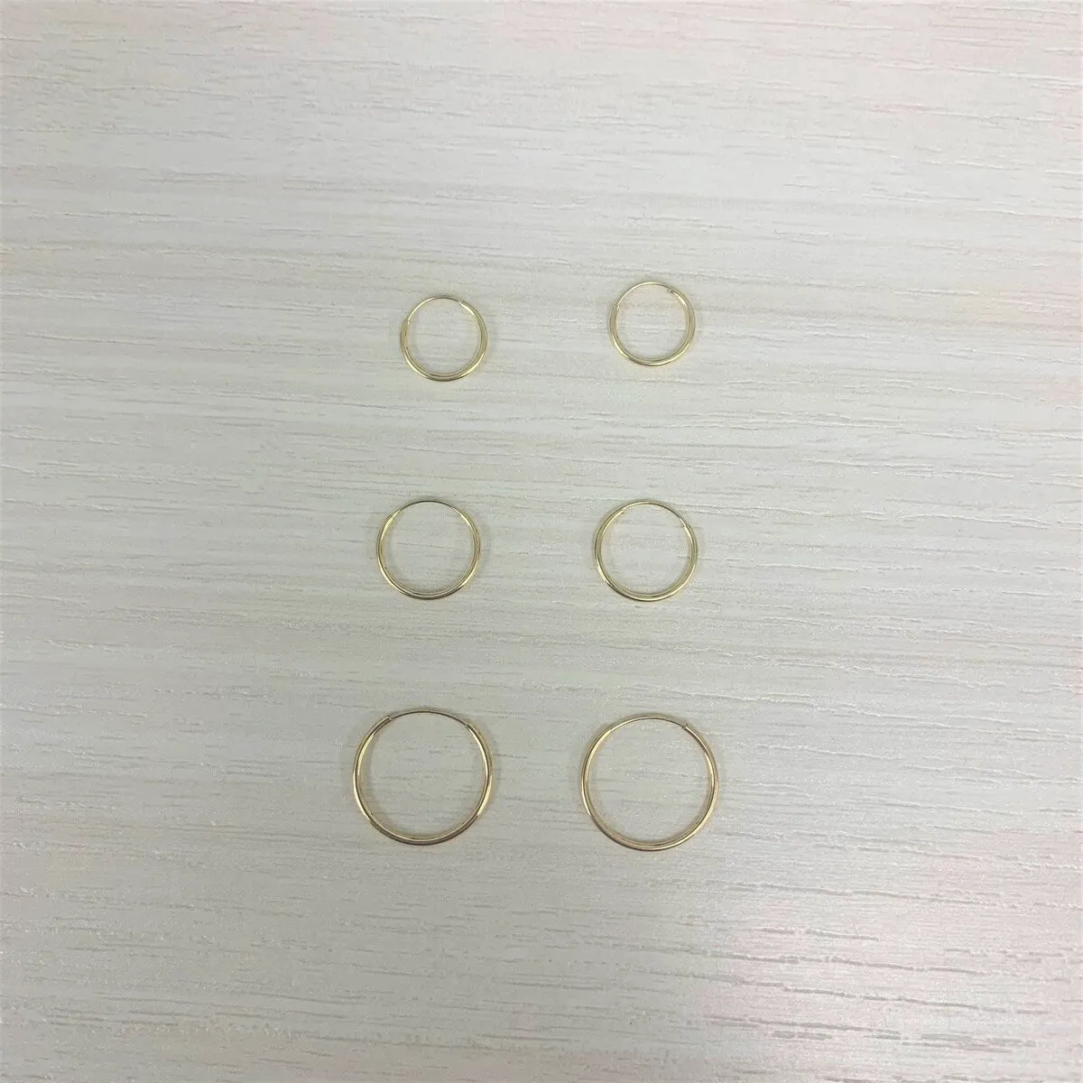 Joelle 14K Yellow Gold Endless Hoops Earrings sold by Zulily product image thumbnail 4