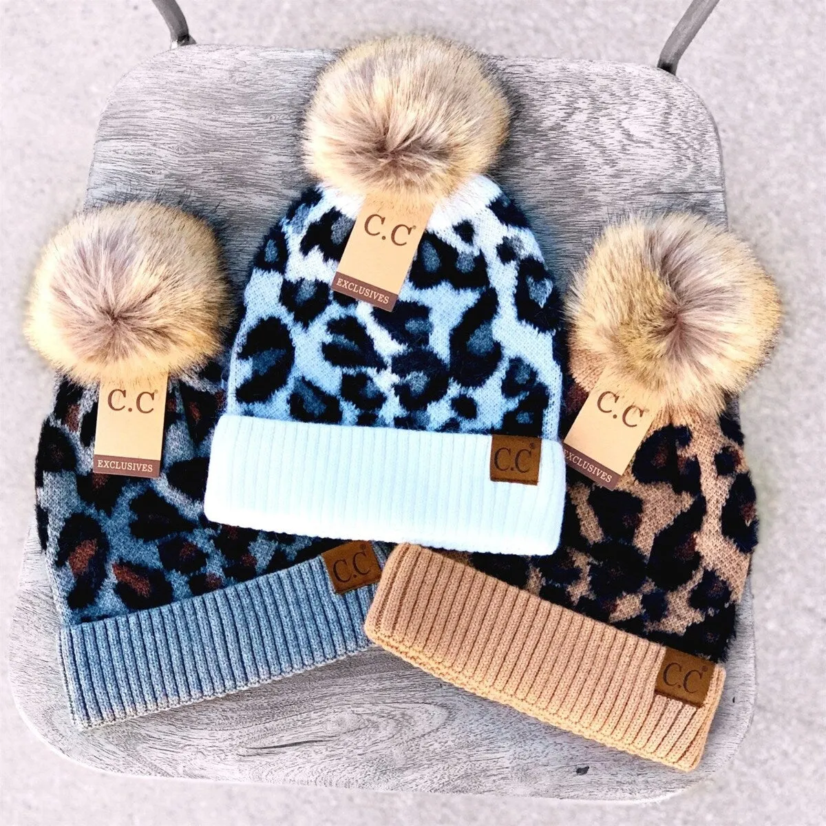 CC Women's Super Soft Leopard Pom Beanie Hats sold by Zulily