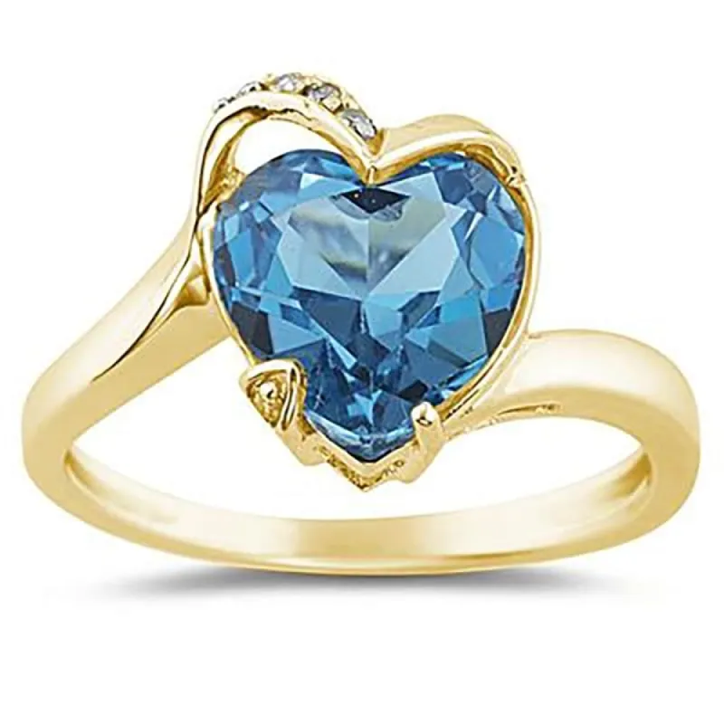 Heart Shaped Blue Topaz and Diamond Curve Ring in 14K Yellow Gold sold by Zulily