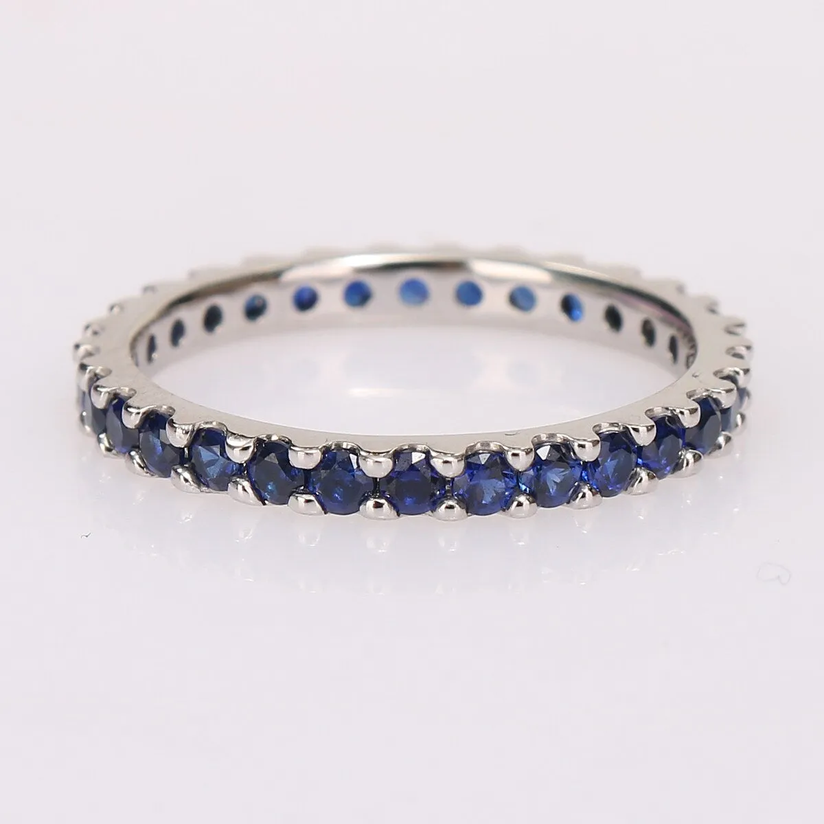 Miadora 10k White Gold Created Blue Sapphire Stackable Eternity Wedding Band Ring sold by Zulily
