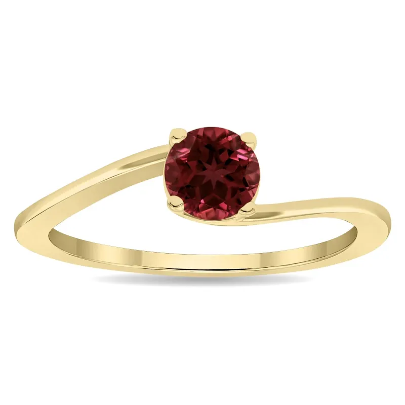 Women's Round Shaped Solitaire Garnet Wave Ring in 10K Yellow Gold sold by Zulily