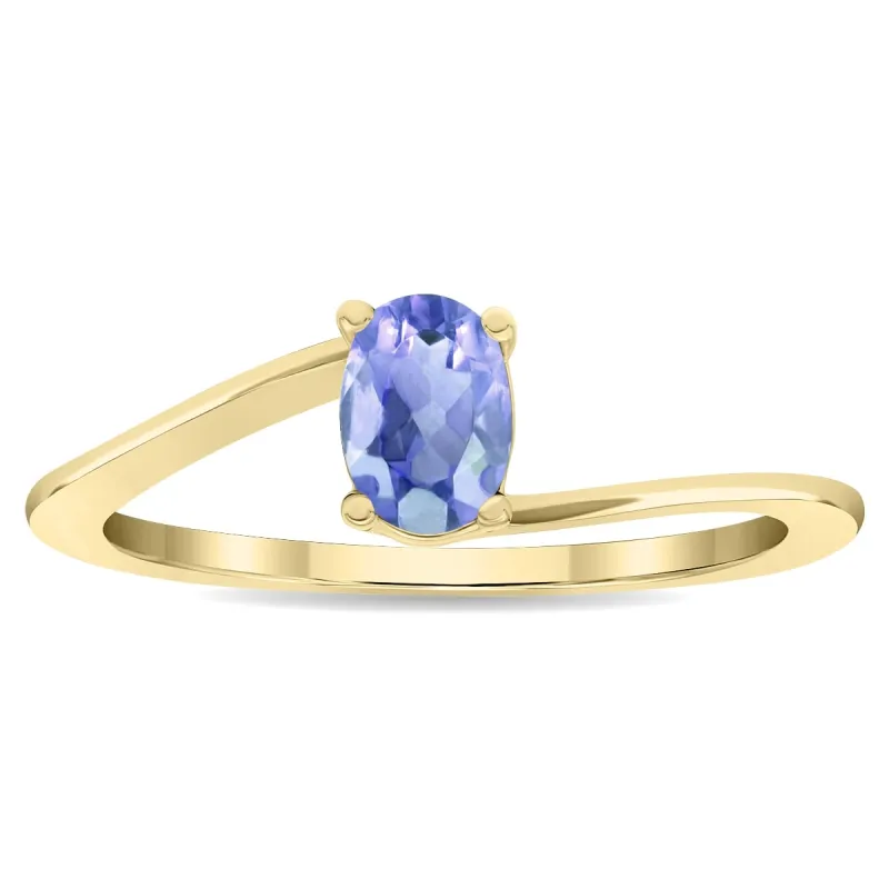Women's Solitaire Oval Shaped Tanzanite Wave Ring in 10K Yellow Gold sold by Zulily