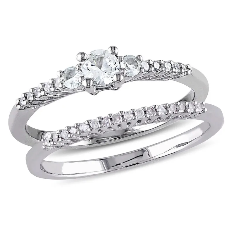 Miadora Sterling Silver Created White Sapphire and 1/10ct TDW Diamond 3-Stone Wedding Ring Set sold by Zulily