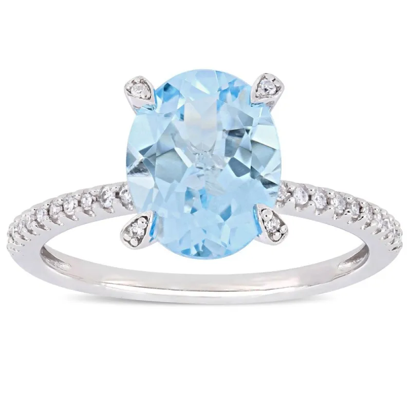 Miadora 10k White Gold Oval-Cut Sky-Blue Topaz and 1/10ct TDW Diamond Solitaire Ring sold by Zulily