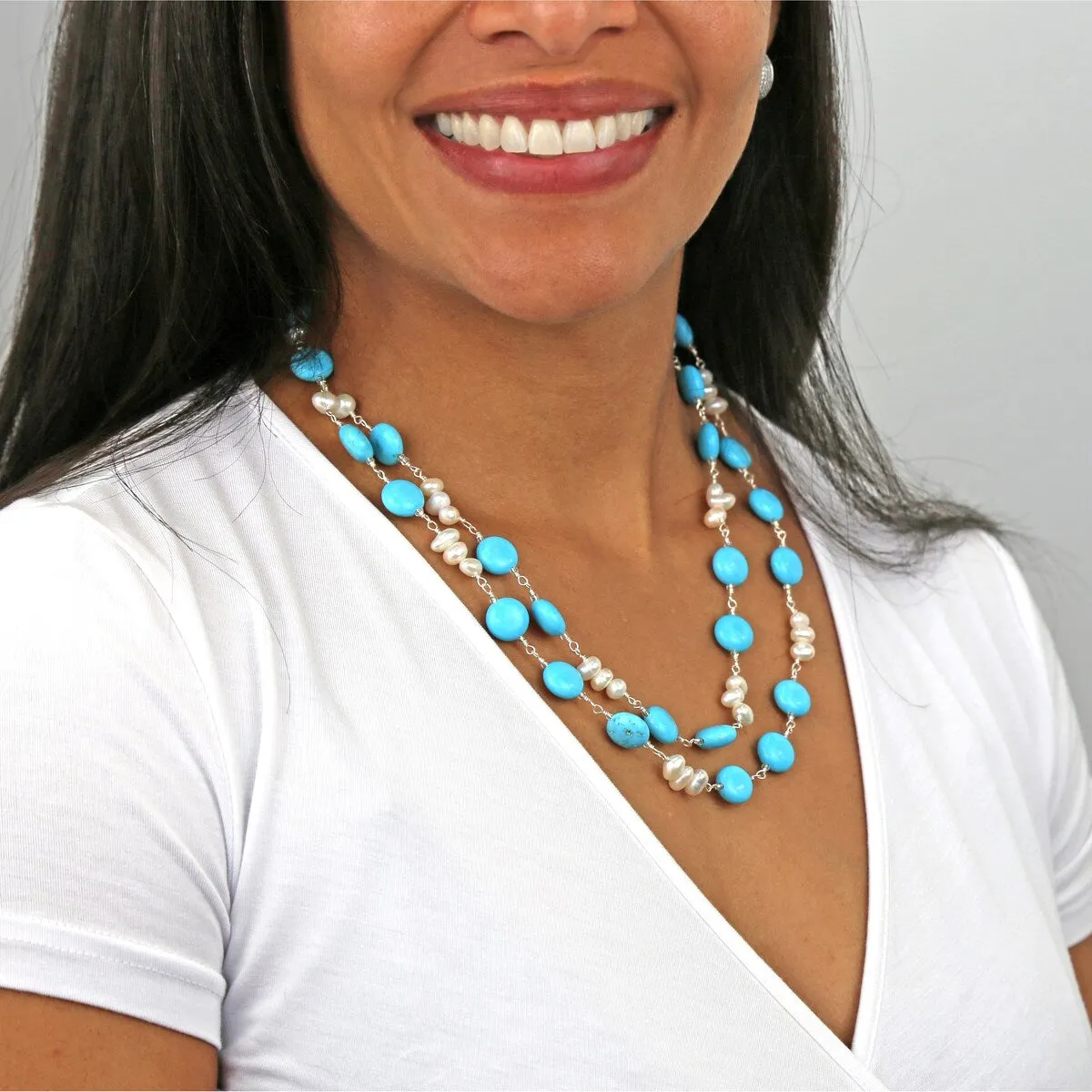 A magnesite turquoise and cultured freshwater pearl wire-wrapped statement necklace. sold by Zulily