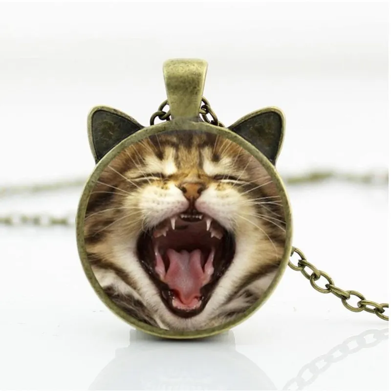 Yawning Brown Cat Pendant Necklace - White sold by Zulily