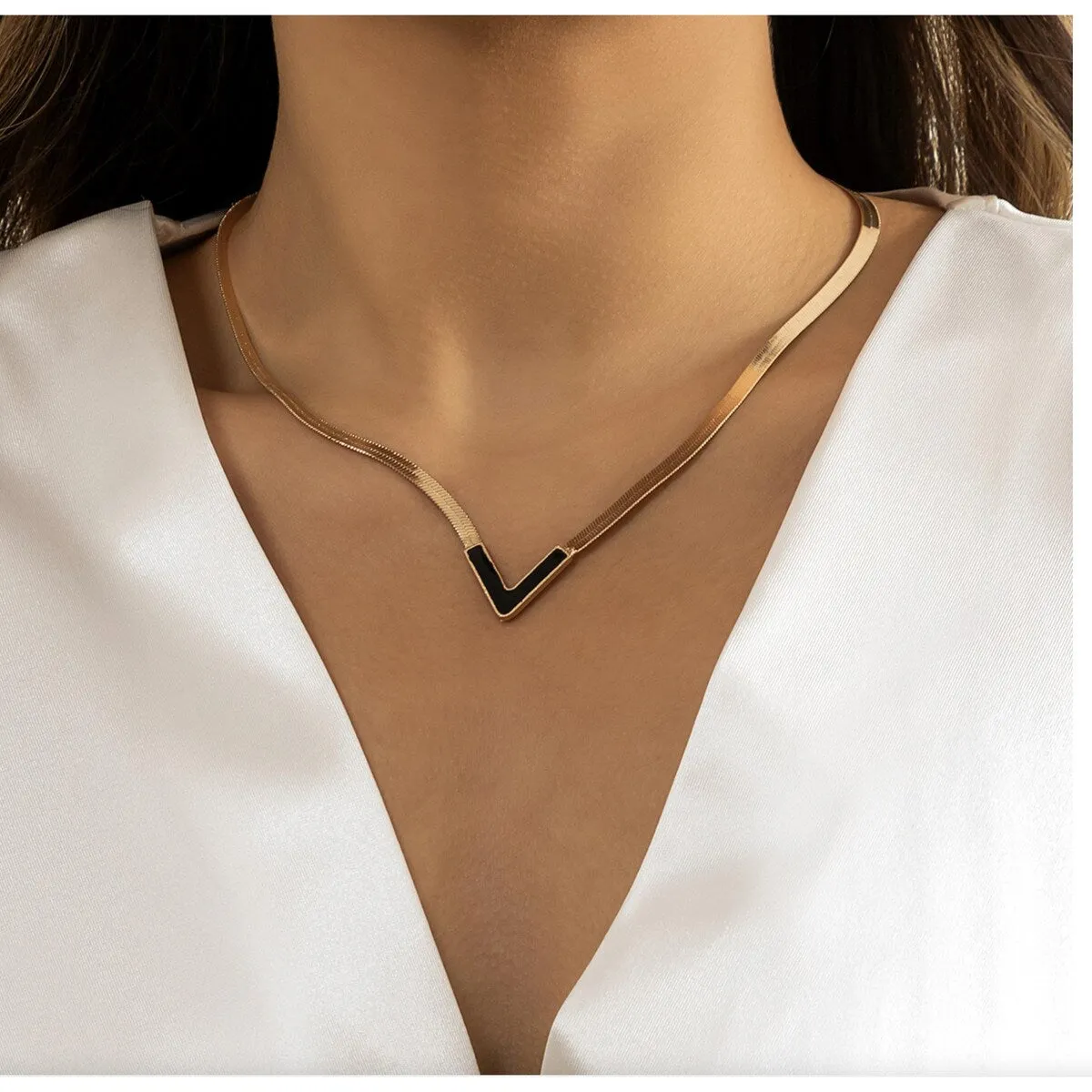 Goldtone Black Chevron Necklace - White sold by Zulily