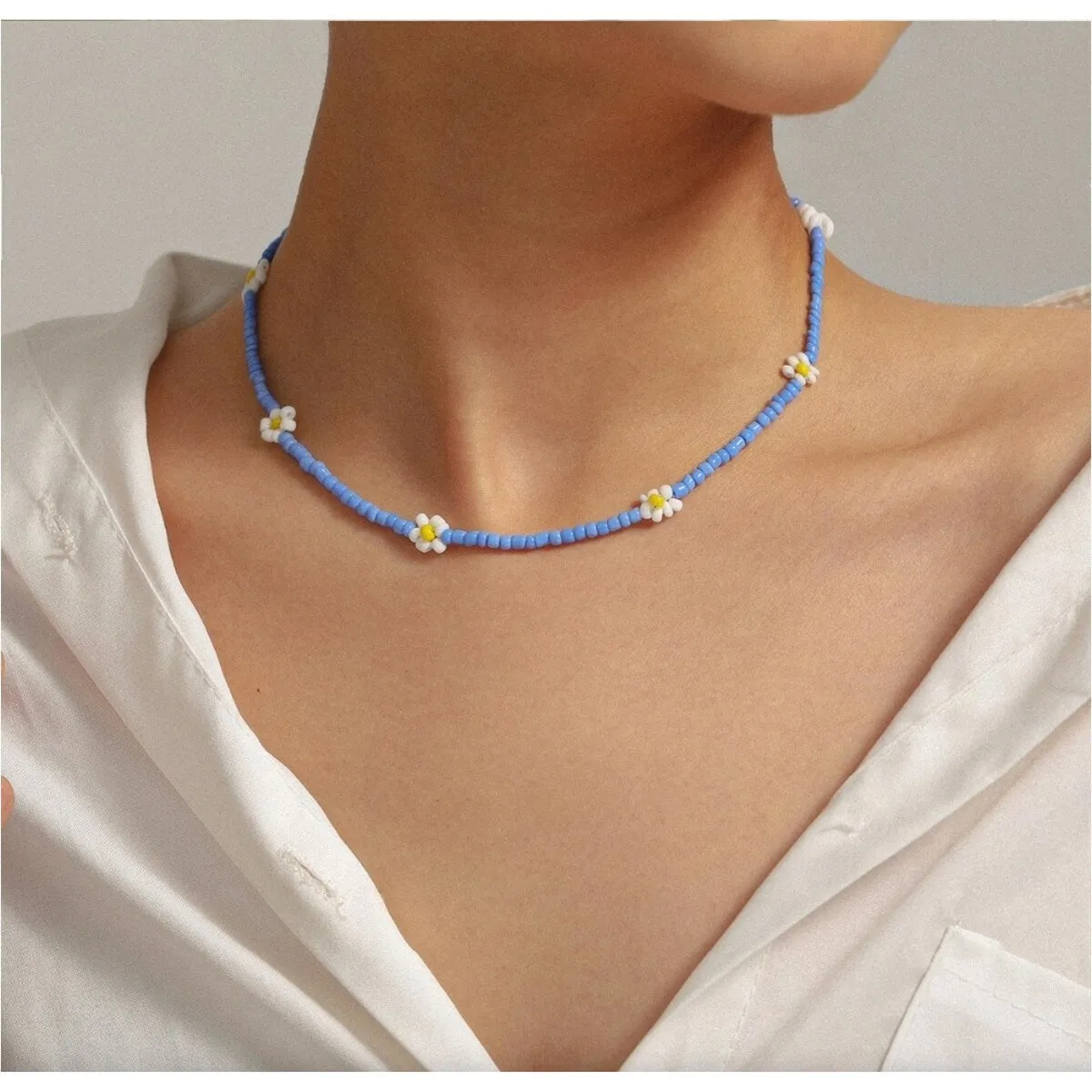 Blue Beaded Daisy Necklace - White sold by Zulily