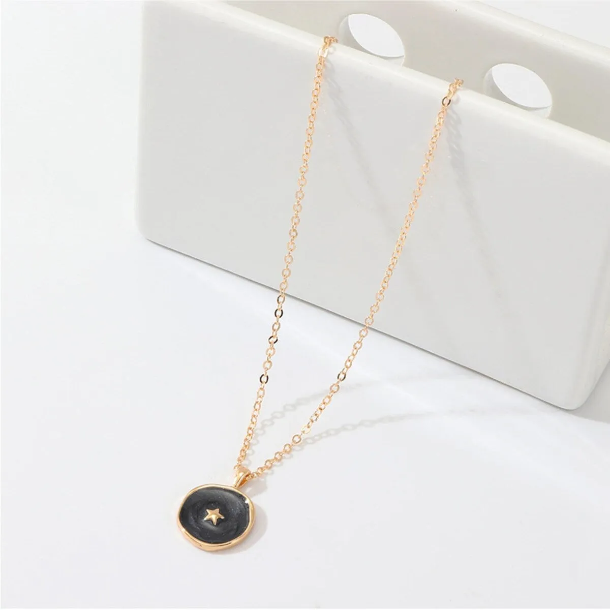 Goldtone Black Circular Star Pendant Necklace - White sold by Zulily