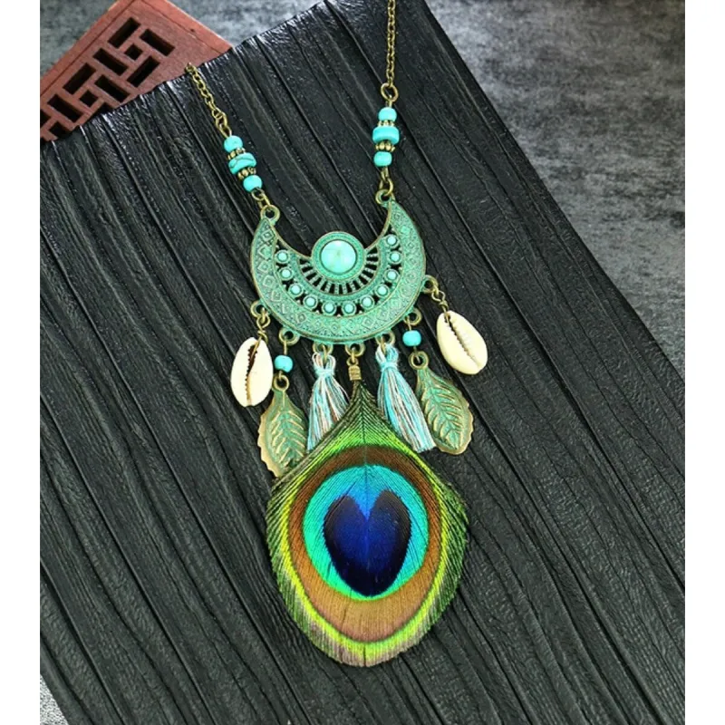 Goldtone Turquoise Boho Peacock Feather Necklace - White sold by Zulily