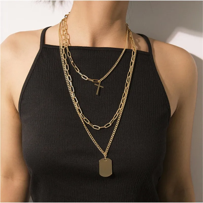 Goldtone Layered Necklace With Dog Tag And Cross - White sold by Zulily