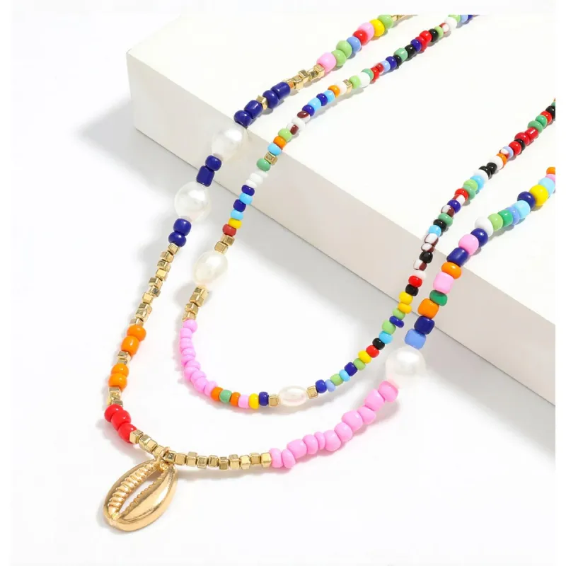 Multi Colored Beaded Layered Necklace With Goldtone Shell - White sold by Zulily