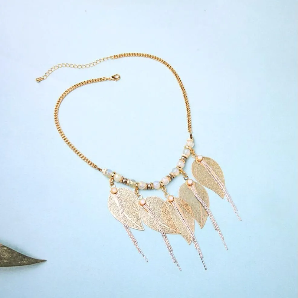 Goldtone Leaves Necklace - White sold by Zulily