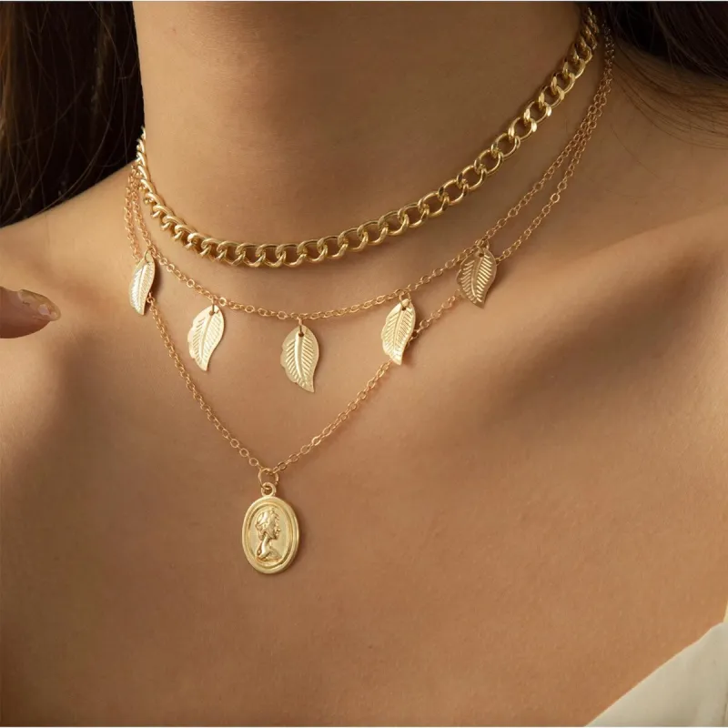Goldtone Layered Leaf Necklace - White sold by Zulily
