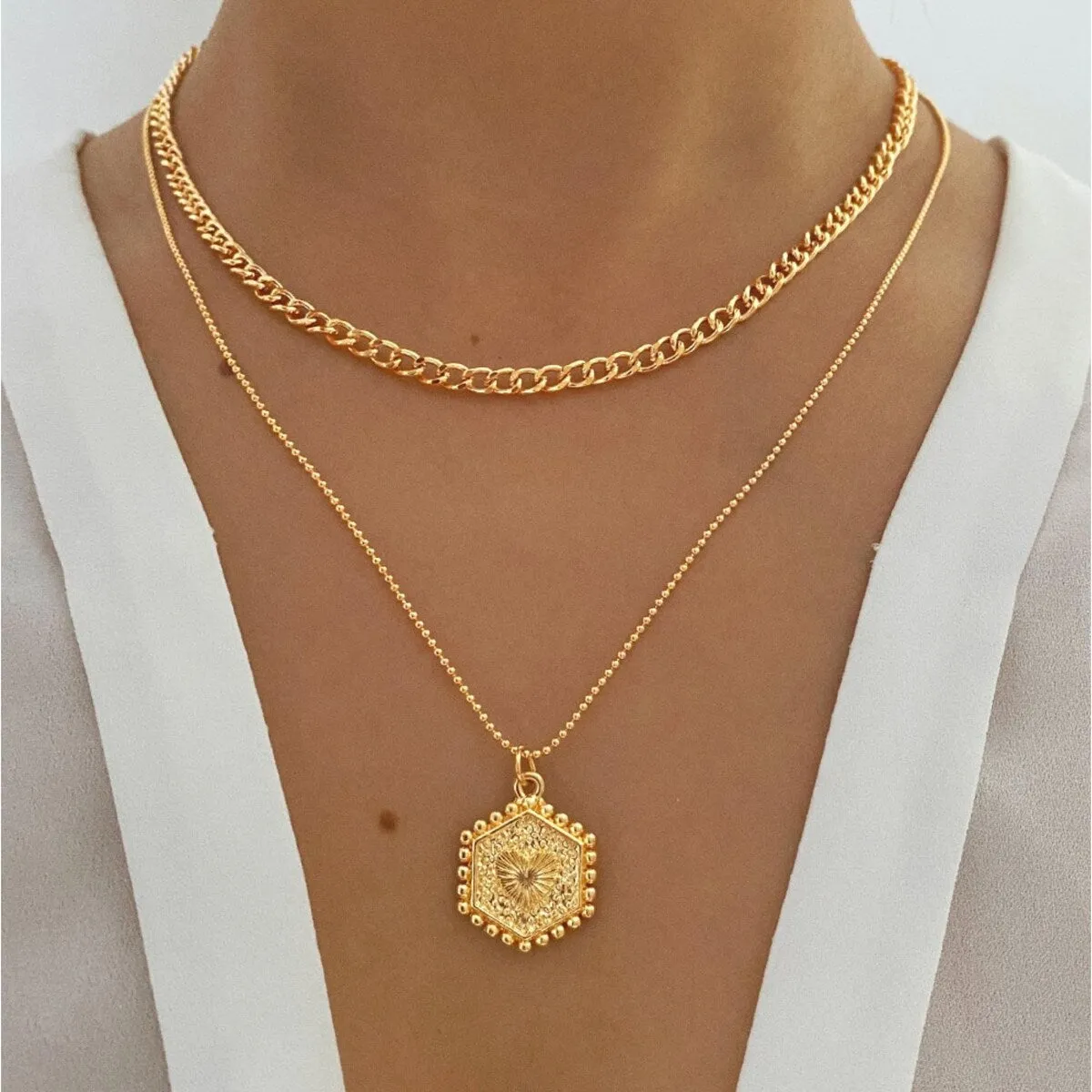 Goldtone Layered Heart Medallion Necklace - White sold by Zulily