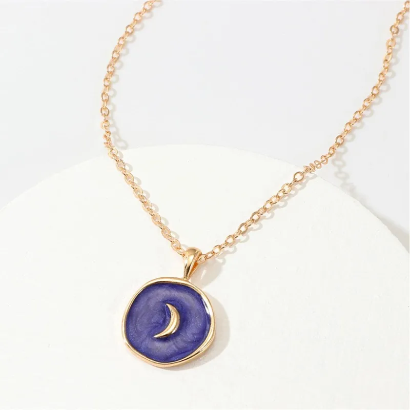 Goldtone Blue Circular Moon Pendant Necklace - White sold by Zulily