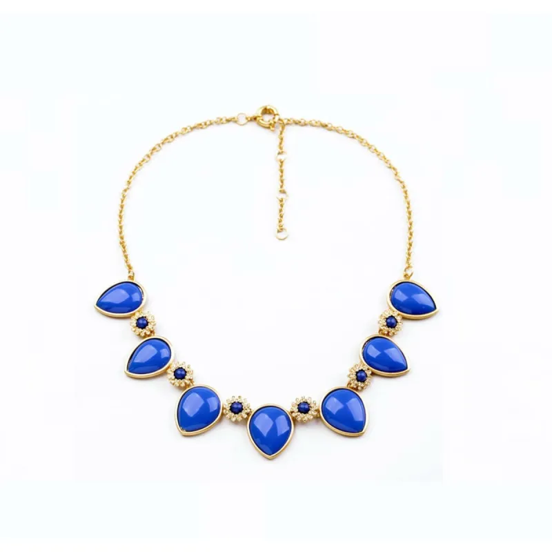Blue Teardrop Flower Bib Necklace - White sold by Zulily