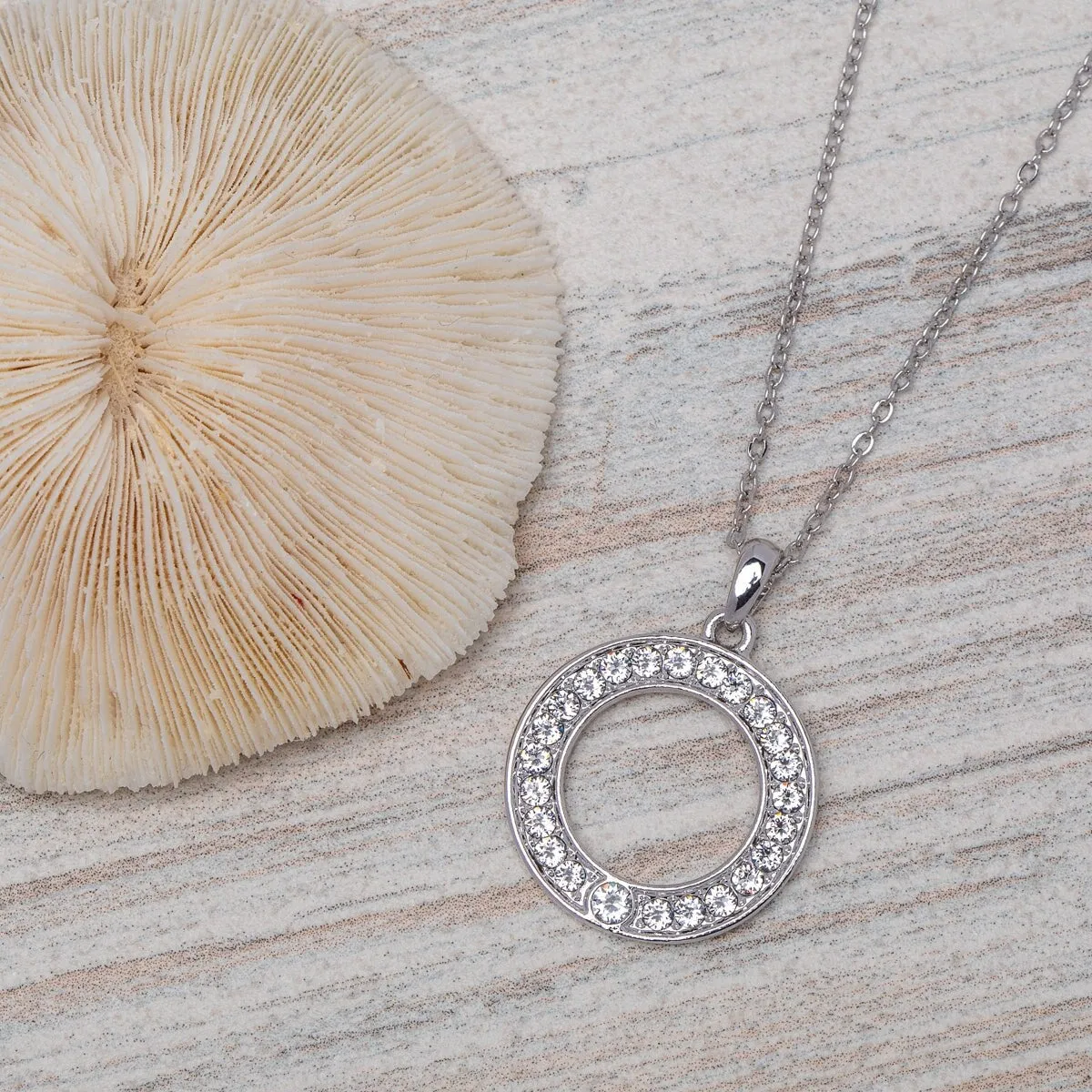 Silvertone Open Circle Pendant With Swarovski Crystals - White sold by Zulily
