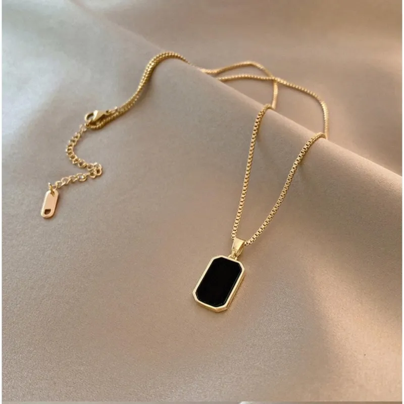 Goldtone Black Prism Pendant Necklace - White sold by Zulily