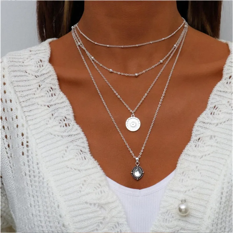 Silvertone Four Layered Necklace With Dainty Crystal - White sold by Zulily