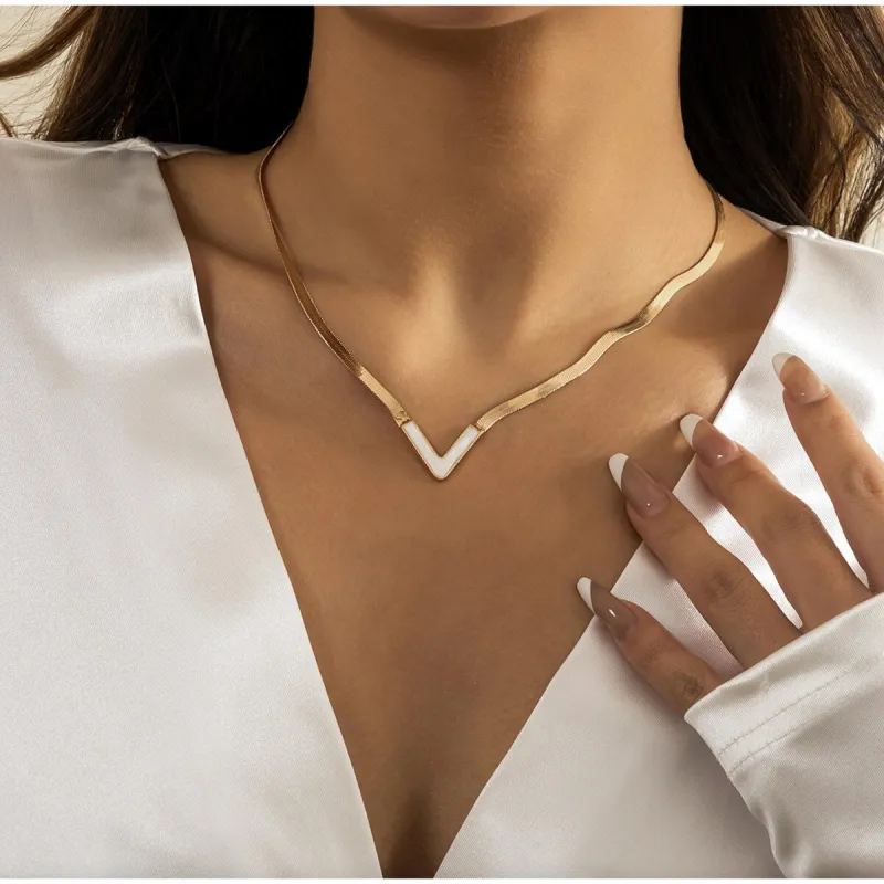 Goldtone White Chevron Necklace sold by Zulily