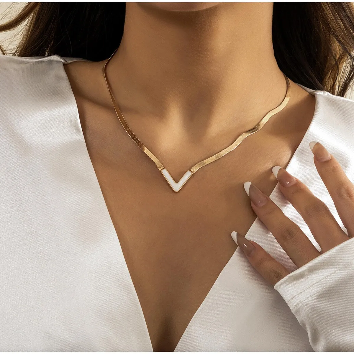 Goldtone White Chevron Necklace sold by Zulily