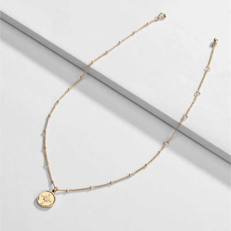 Goldtone Dainty Compass Pendant Necklace - White sold by Zulily