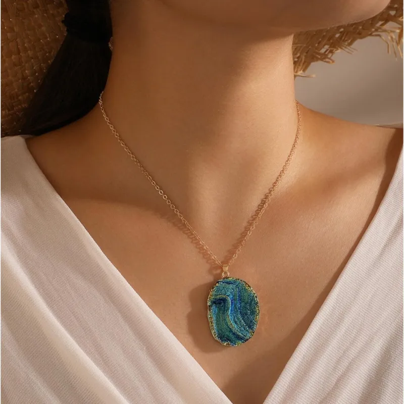 Goldtone Blue Geode Style Oval Pendant Necklace - White sold by Zulily