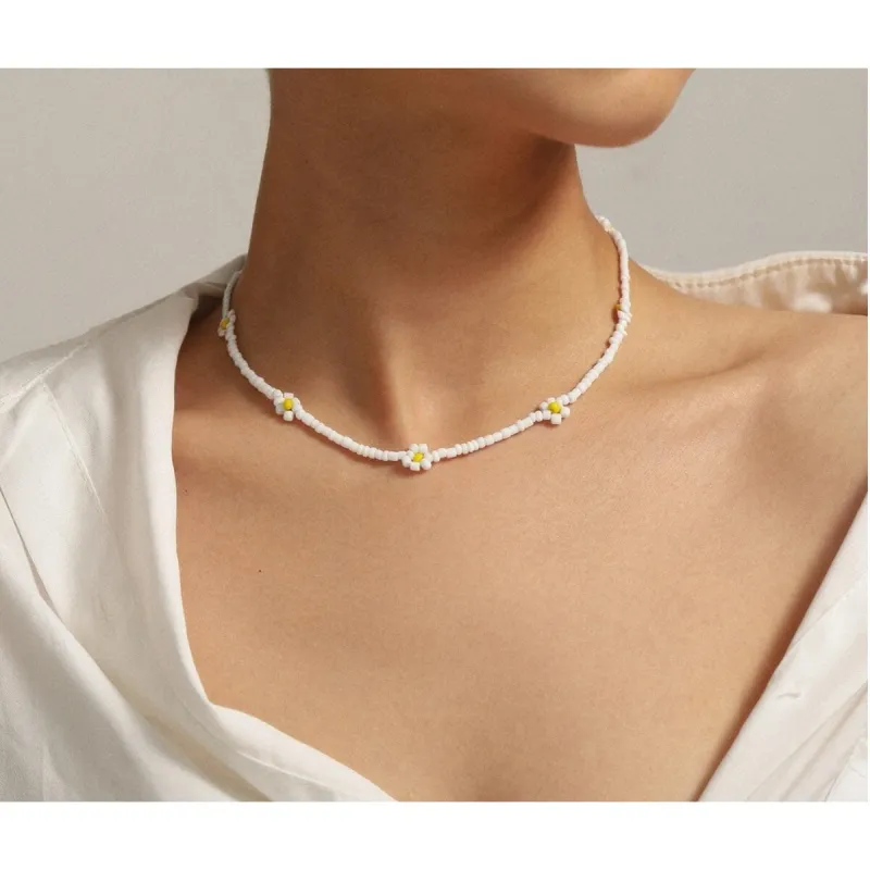 White Beaded Daisy Choker Necklace sold by Zulily