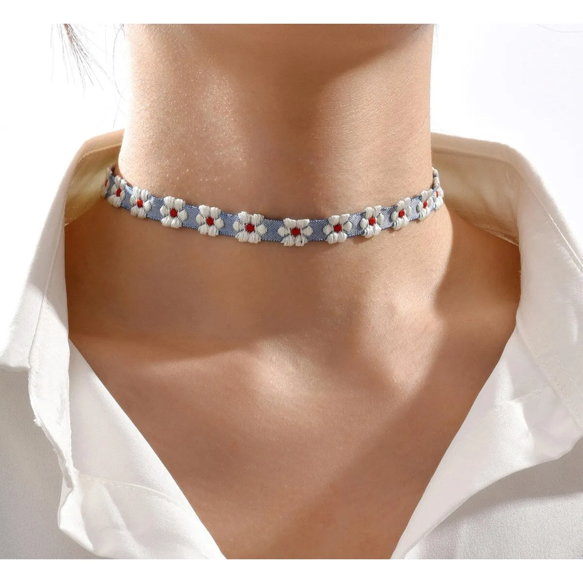 Blue & White Embroidered Daisy Choker Necklace sold by Zulily