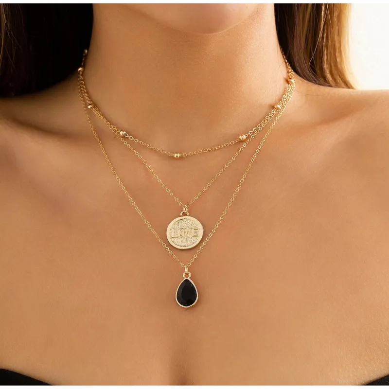 Goldtone Layered Love Black Teardrop Necklace - White sold by Zulily