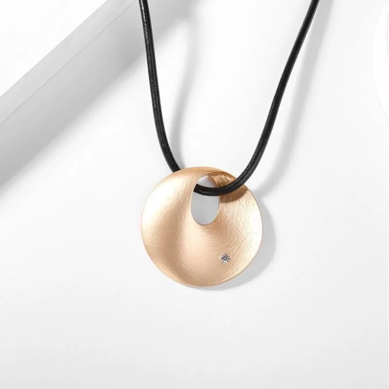 Black Cord Rose Gold Circular Necklace - White sold by Zulily