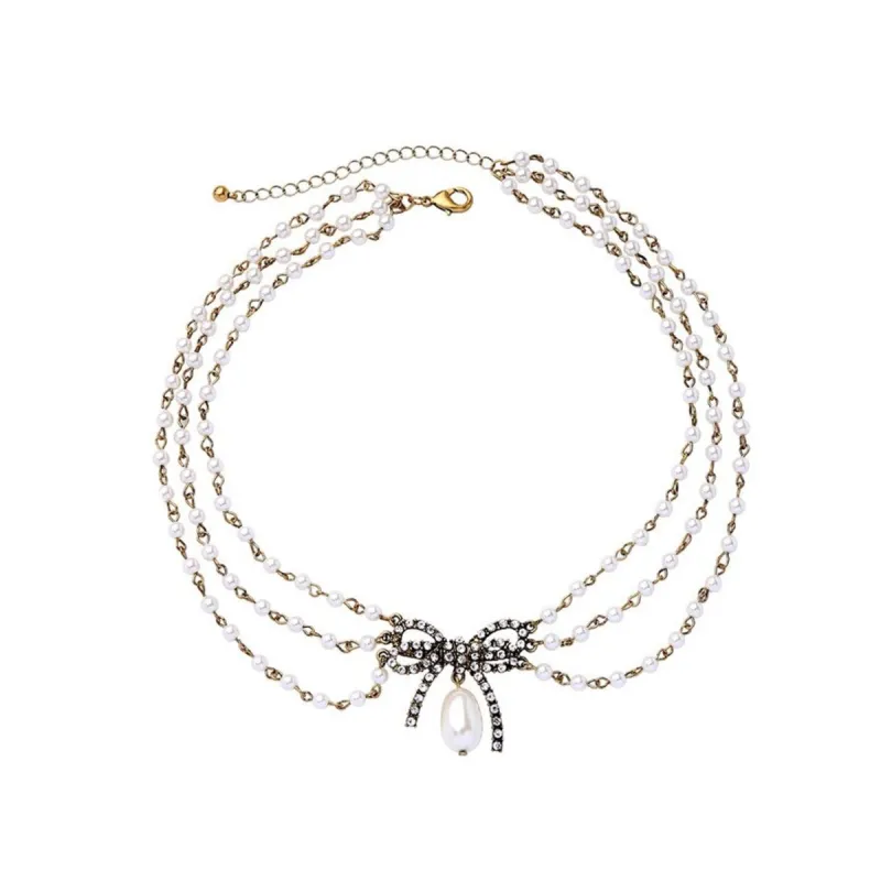 Imitation Pearl Multi-strand Bow Necklace - White sold by Zulily