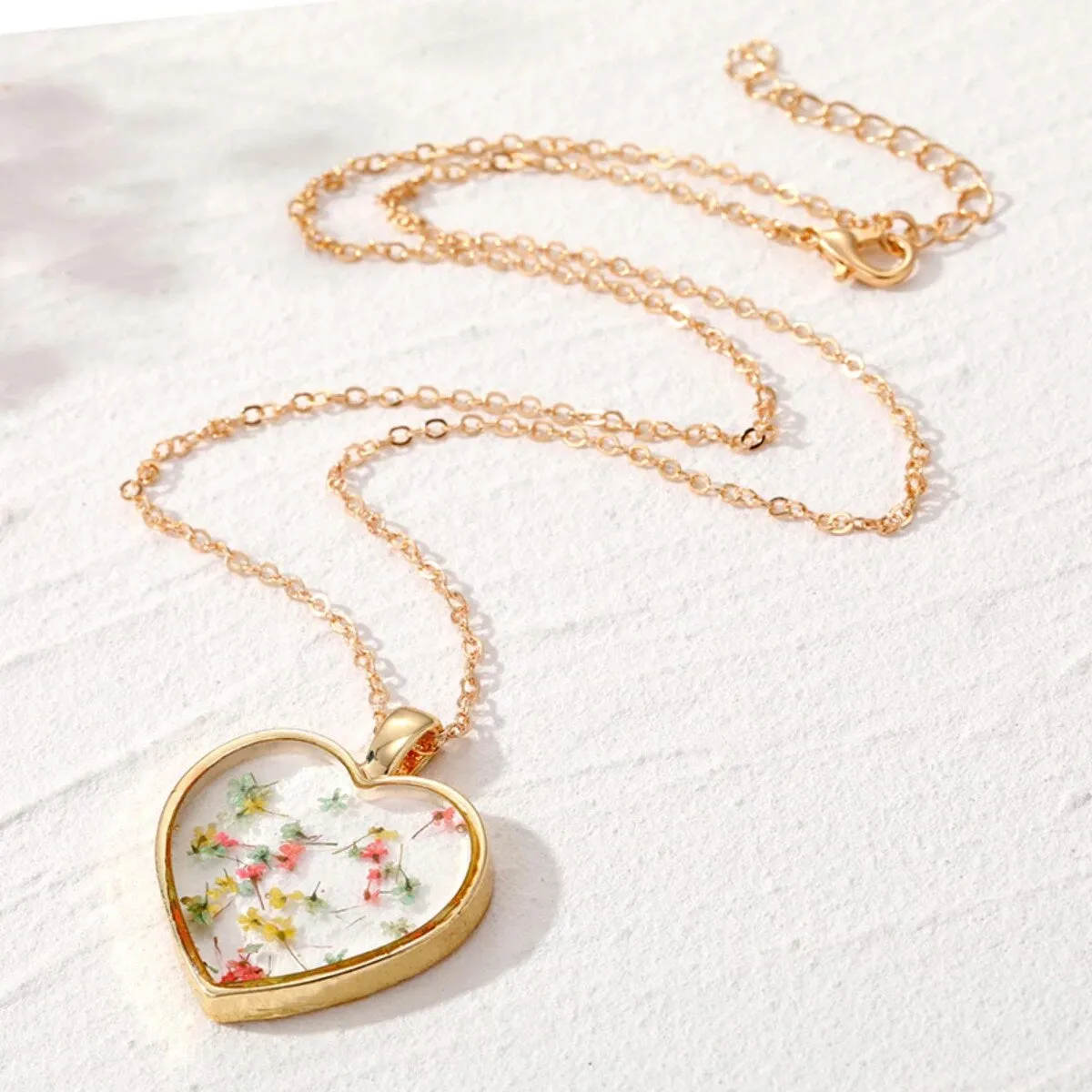Goldtone Transparent Floral Heart Pendant Necklace - White sold by Zulily