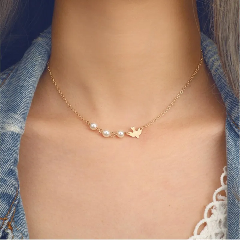 Dainty Goldtone Imitation Pearl Bird Necklace - White sold by Zulily