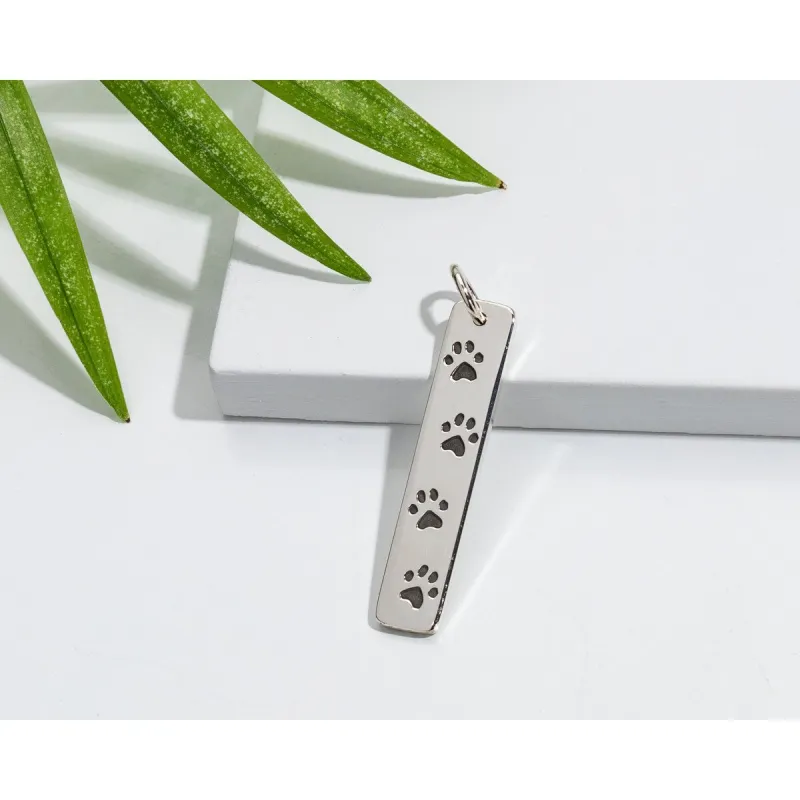 Sterling Silver Rectangular Pendant With Paw Prints sold by Zulily