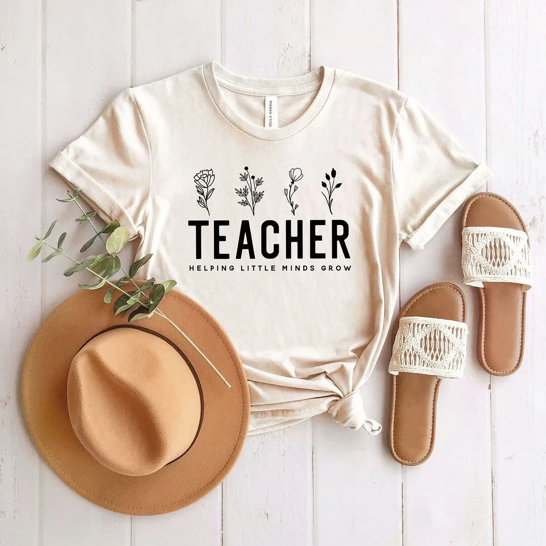 Helping Little Minds Grow Short Sleeve Crewnneck Tee sold by Zulily