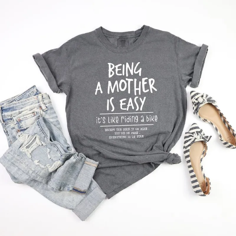 Being A Mother Is Easy Garment Dyed Tee sold by Zulily